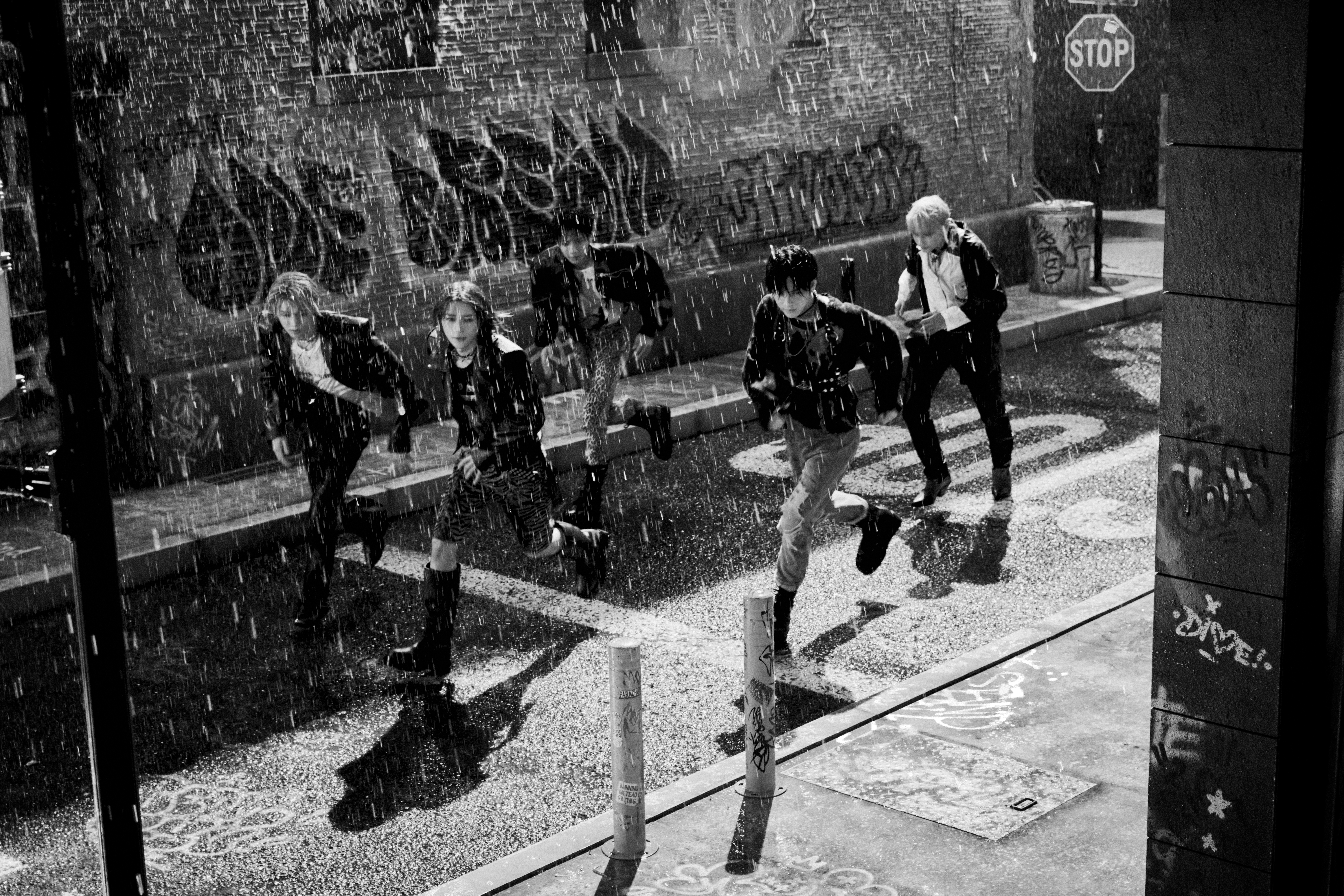 TXT Concept: Reality. All 5 members running in black and white.